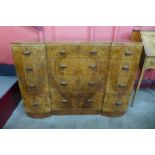 An Art Deco amboyna breakfront chest of drawers, 88cms h, 123cms w, 53cms d