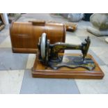 A walnut cased Singer sewing machine