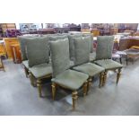 A set of eleven Italian giltwood and green fabric upholstered chairs