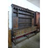 A William III and later oak geometric moulded dresser