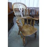 A Victorian style elm highback Windsor armchair