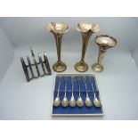 A silver toast rack, a set of six .800 silver spoons, a pair of silver posy vases and one other