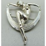 A silver Art Deco style dancing lady brooch