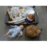 A collection of assorted items including dolls, a wooden cat, a clock, a cookie jar and a large