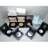 A collection of base metal commemorative coins, boxed (8)