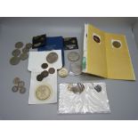 A collection of commemorative coins, some half silver coins and three £5 coins