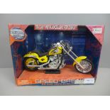 A 1:9 scale yellow chopper motorcycle, boxed