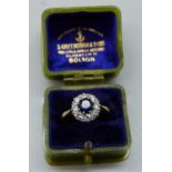 An 18ct gold, sapphire and diamond cluster ring, 2.6g, L