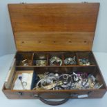 A collection of costume jewellery in wooden box
