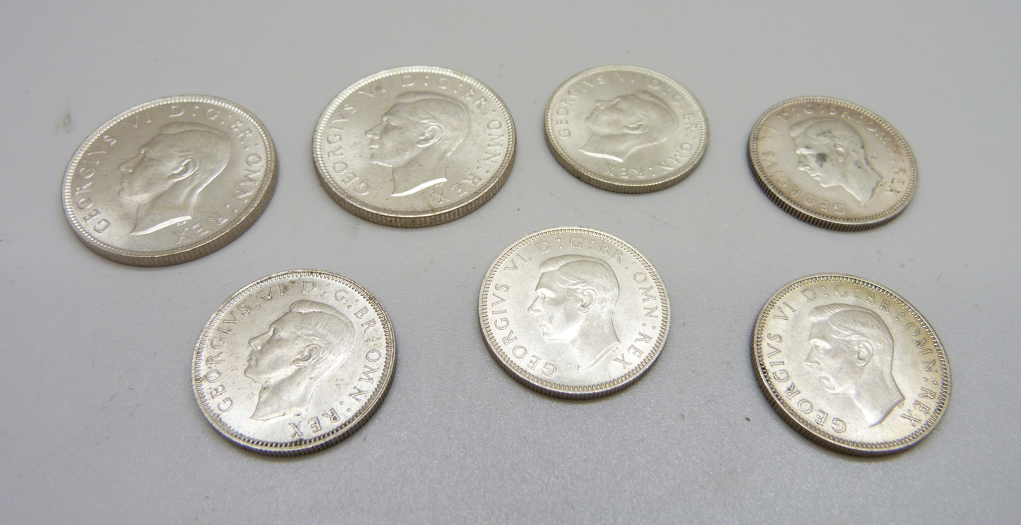 Seven coins; two 1944 shillings and five one shilling 1943, 1944, 2x 1945 and 1946