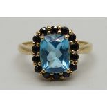 A 9ct gold, blue topaz and sapphire ring, blue topaz 9.08mm x 7.04mm, 3g, P