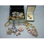 Costume brooches and a pair of gold plated cufflinks