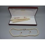 A Shima faux pearl necklace and a pair of 9ct gold faux pearl earrings