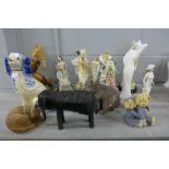 A collection of pottery, resin and wooden figures and animals including a Staffordshire blue and