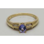 A 9ct gold, purple stone and baguette diamond set ring, 1.8g, P