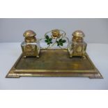 A gilt metal ink stand with a pair of glass inkwells, with inscription