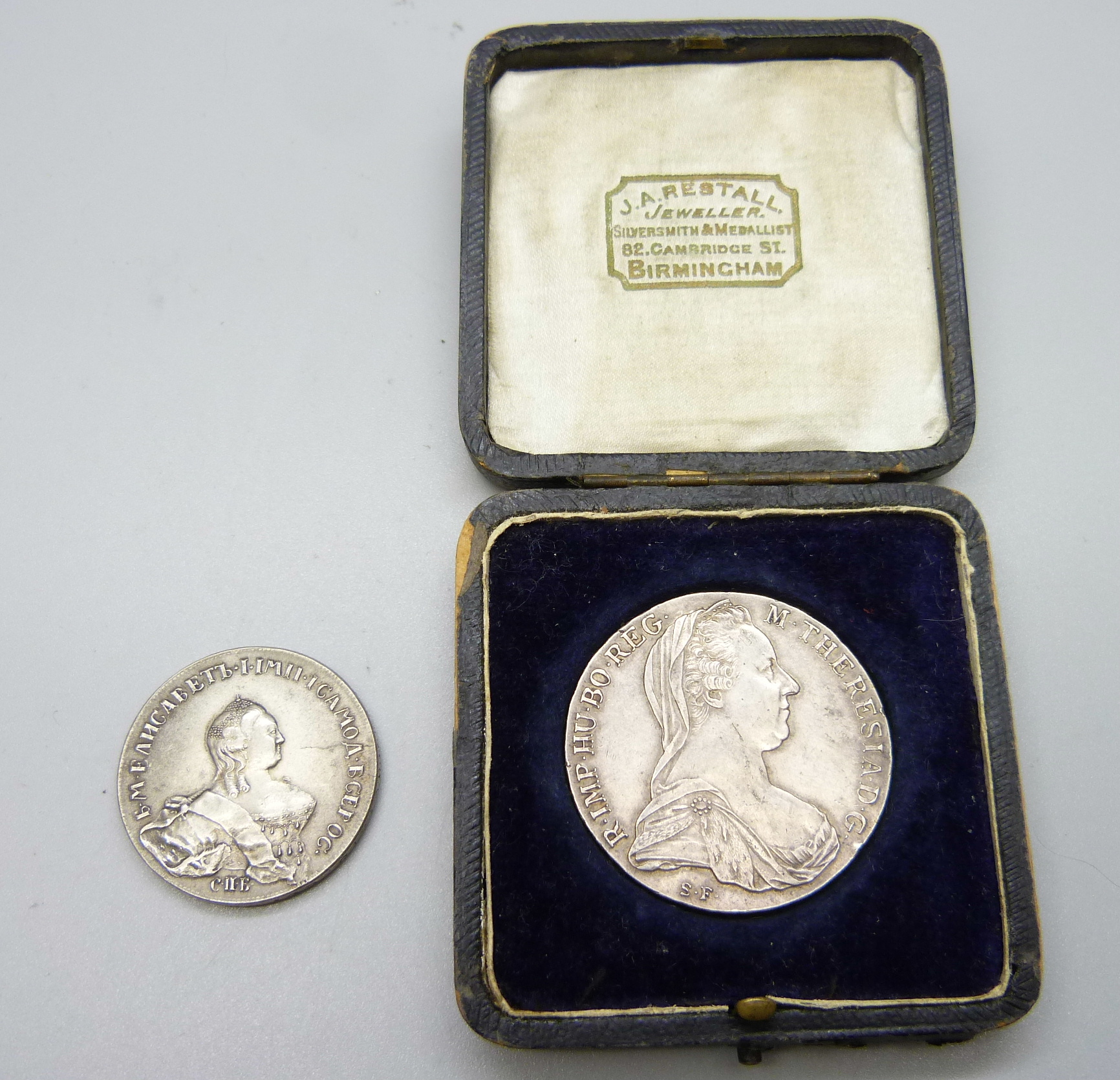 A Maria Theresia 1780 coin and a 1921 Austro-Hungarian coin