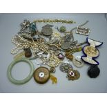 A collection of vintage jewellery including a jade bangle