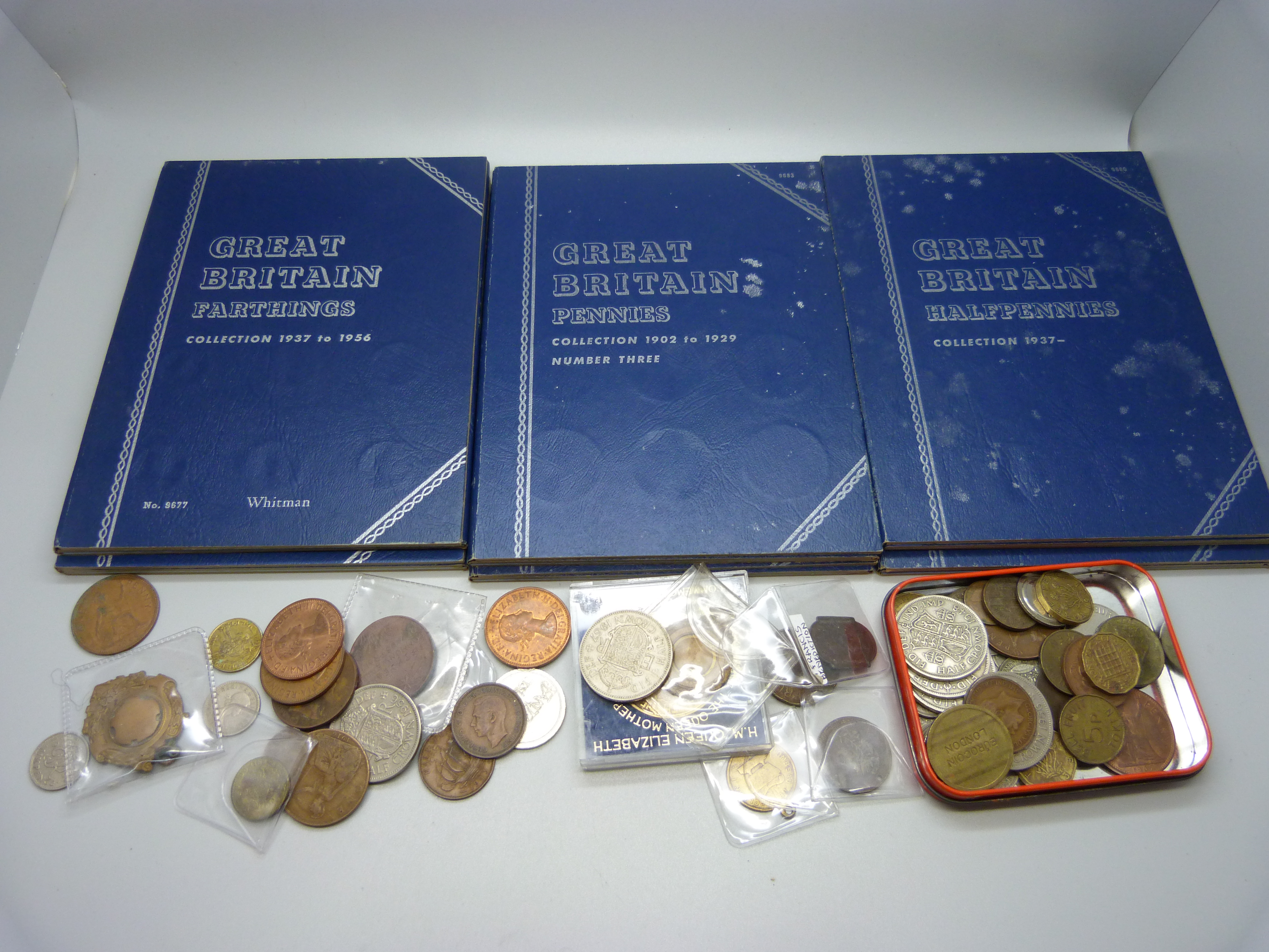 A collection of assorted British pre decimal coins, medals and tokens including six Whitman