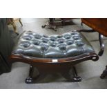 A mahogany and green leather Chesterfield footstool