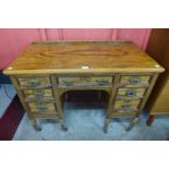 A Victorian Maple & Co. figured walnut desk