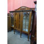 An Edward VII inlaid mahogany three door breakfront side cabinet