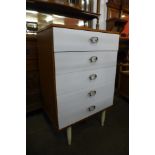 A teak and white laminate chest of drawers
