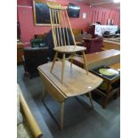 An Ercol Blonde elm and beech drop-leaf table and a Goldsmith chair