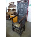 A 17th Century style oak Wainsot chair, with extensive commemorative carving of William III