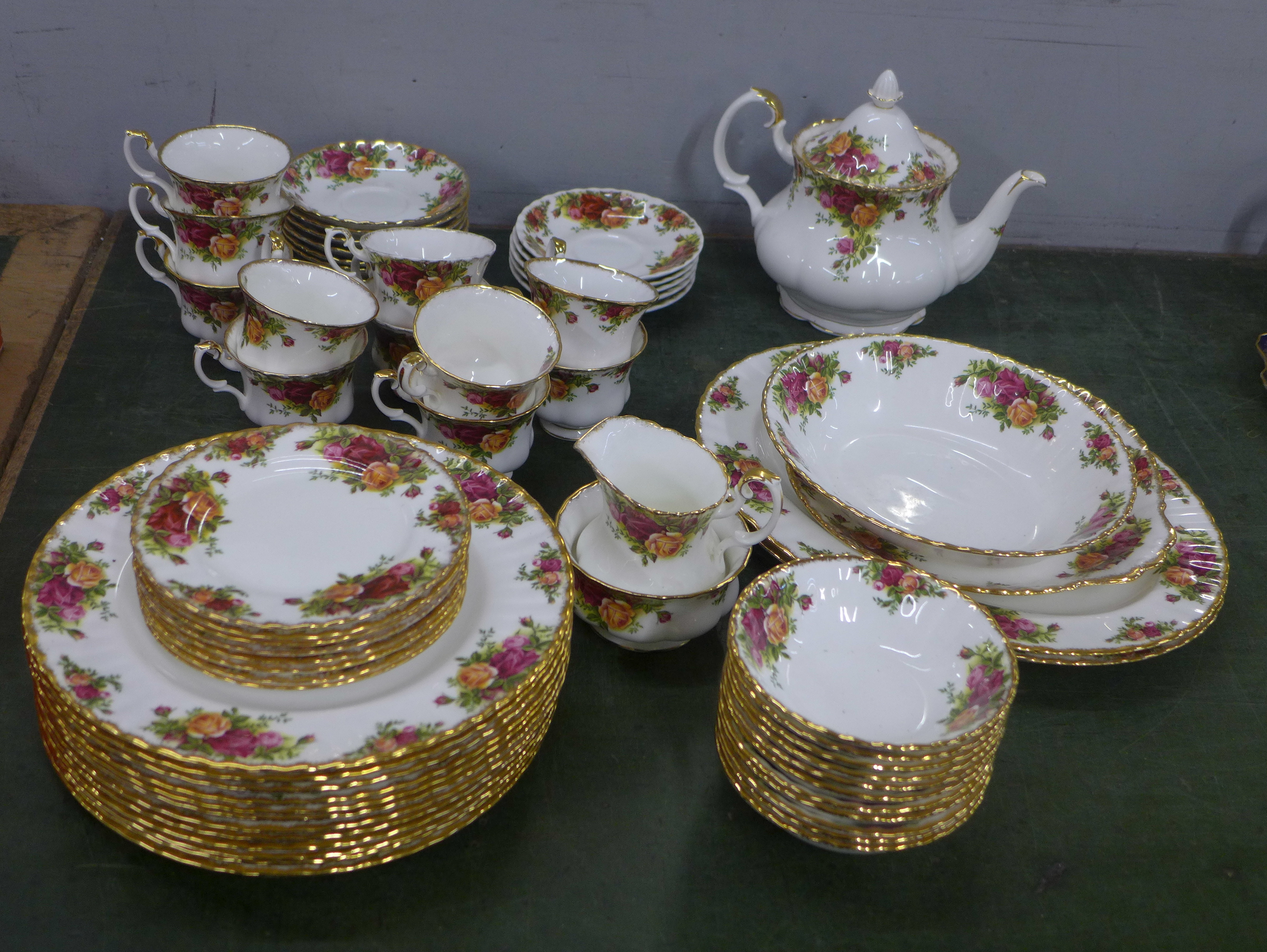 A large collection of Royal Albert Old Country Roses including a teapot, a cream jug (small chip