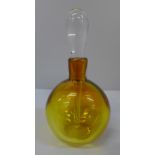A heavy amber glass perfume bottle, etched mark to base