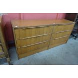 A teak chest of drawers