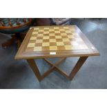 A teak games/coffee table