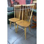 A pair of Ercol Blonde elm and beech 684 model chairs