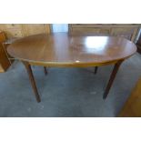 A McIntosh teak oval extending dining table