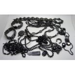 A bag of jet and black bead jewellery