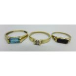 Three 9ct gold rings - one set with a diamond, N, one with cut out heart design and black inlay,