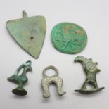 A collection of small carved figurines, a token etc., possibly Roman