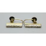 A pair of 9ct gold screw back earrings set with diamonds, 2.4g