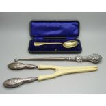 A silver spoon, silver button hook and a silver handled glove stretcher