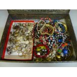 A box of bracelets and costume rings