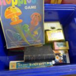 A box of vintage games including Poppin Hoppies