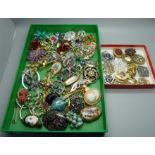 A collection of scarf clips and brooches