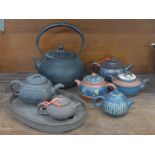 Six Chinese terracotta teapots and a Japanese cast iron kettle