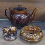 A Victorian treacle glaze plate, an elephant money bank and large teapot, lid a/f on inner lip