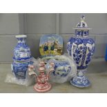 A large blue vase with lid, a small vase without lid, two cookie vases, a candle holder, blue plates