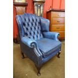 A Chesterfield blue leather wingback armchair