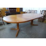 A Danish teak extending dining table