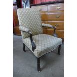 A 19th Century Chippendale style carved mahogany and fabric upholstered armchair