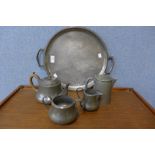 An Arts and Crafts pewter five piece tea and coffee service